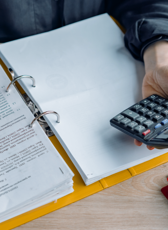 person holding a calculator